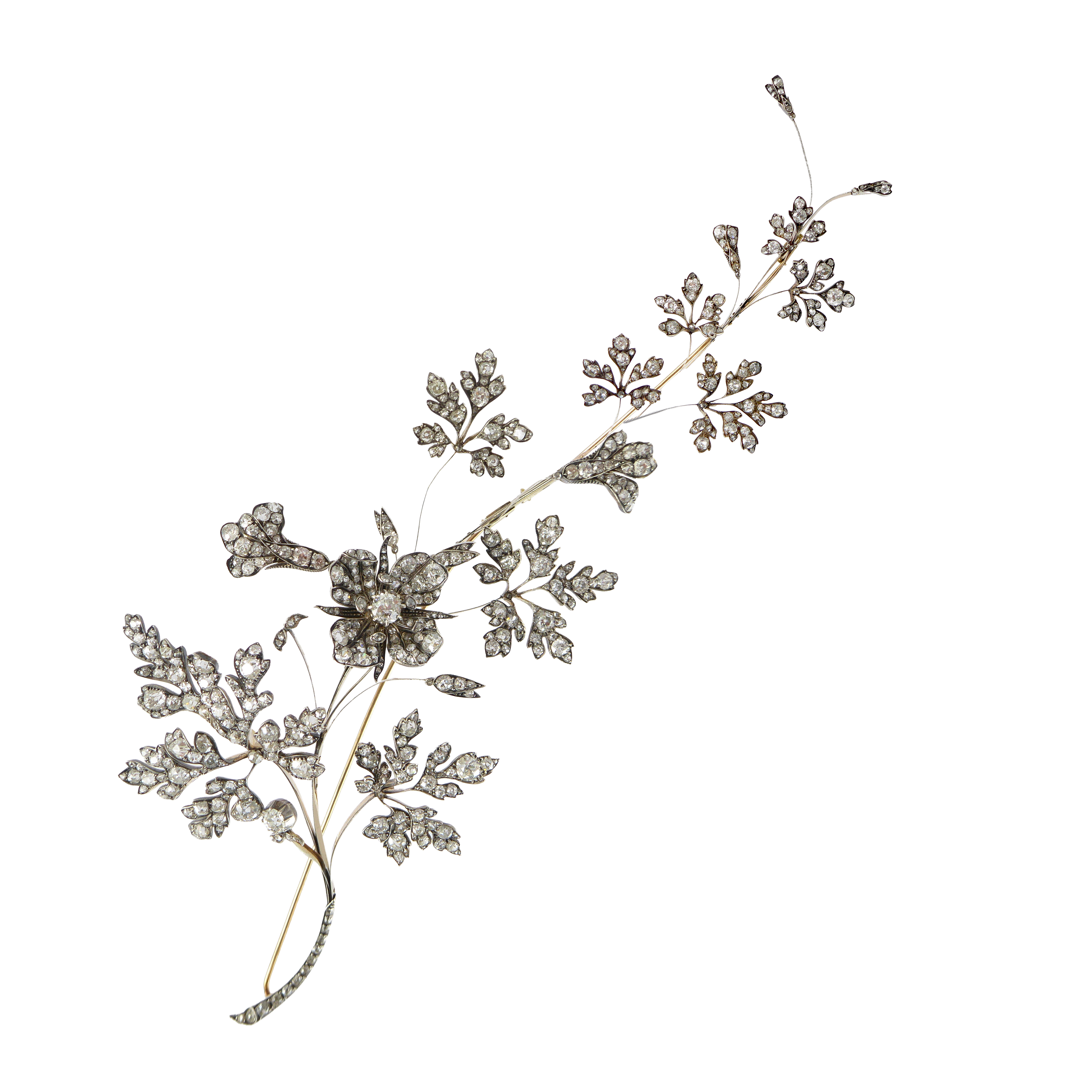 Late 19th century large tremblant diamond flower spray brooch, French c.1890, in the manner and craftsmanship of Chaumet or Boucheron, the sinuous branch of asymmetric design,